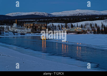 WHITEHORSE, YUKON, CANADA, March 8, 2019 : Night on the Yukon banks. Whitehorse is the capital and only city of Yukon, and the largest city in Norther Stock Photo