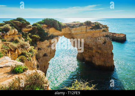 Natural arch above ocean, Arco de Albandeira, Algarve, Portugal Stock Photo