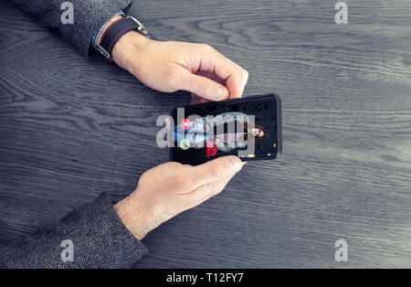 Adult man using dating app on mobile phone. Matching app concept Stock Photo