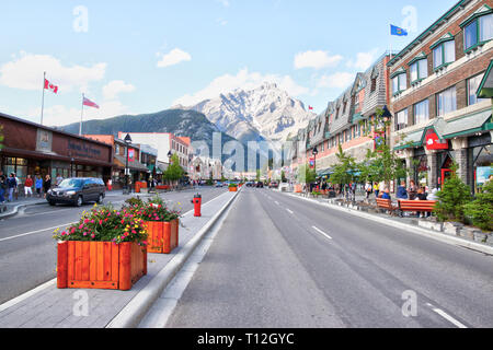 BANFF, CANADA - JULY 3, 2011: Banff Avenue in the Banff National Park of Alberta with Mount Cascade in the background. The townsite is a major Canadia Stock Photo