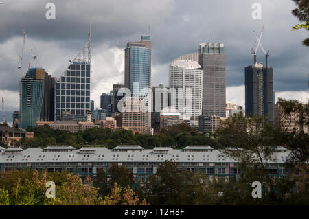 City of Sydney seen beyond the Botanic Garden and Finger Wharf at Woolloomooloo. Former warehouse on Finger Wharf has become the upscale Hotel Ovolo. Stock Photo