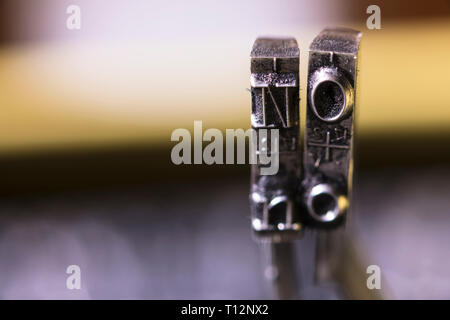 Macrophotography of typewriter hammers with NO word Stock Photo