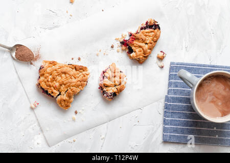 Stack of homemade pieces of cake with fresh jam top view Stock Photo