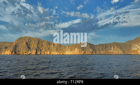 Beautiful mountains reflected in the water. Fjords on the Musandam peninsula. Khasab. Oman Stock Photo