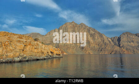 Beautiful mountains reflected in the water. Fjords on the Musandam peninsula. Khasab. Oman Stock Photo