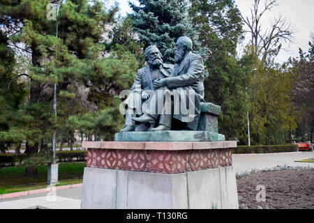 An intimate, sitting sculpture of Karl Marx and Friedrich Engels in Bishkek, Kyrgyzstan. Stock Photo