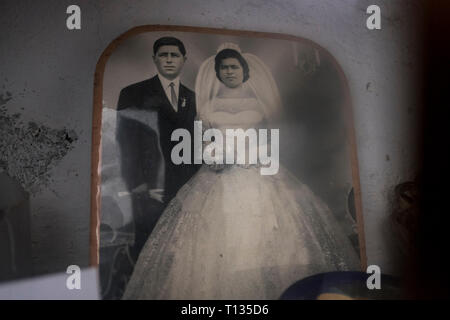 An old wedding photograph in an abandoned house in Paleohora Village on Aegina Island, Greece. Stock Photo