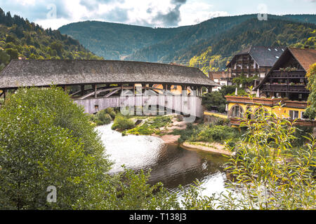 historical wooden covered bridge over the river Murg, landmark of village Forbach, Northern Black Forest, Germany, Murg valley Stock Photo