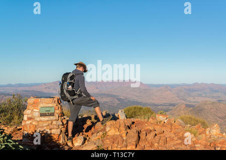 Hiker at the top of Mount Gillen just outside Alice Springs in central Australia. Stock Photo