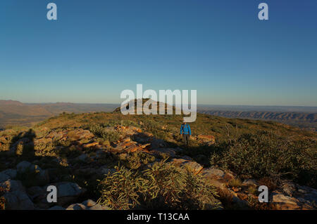 Hiker at the top of Mount Gillen just outside Alice Springs in central Australia. Stock Photo