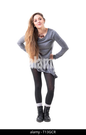 Playful young happy stylish woman getting dressed pulling up tights. Full  body isolated on white background Stock Photo - Alamy