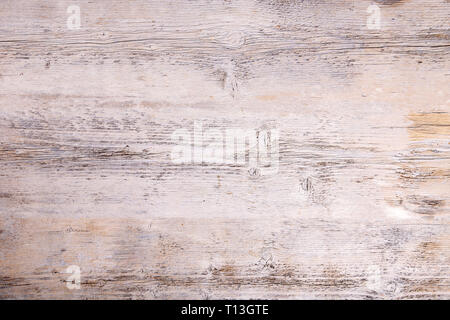 Peeling paint on an old wooden floor. White wooden background Stock Photo