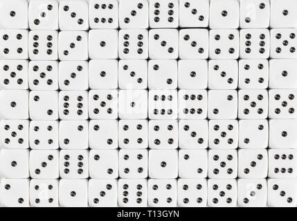 Background pattern of 70 white dices, random ordered Stock Photo