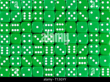 Background pattern of 70 green dices, random ordered Stock Photo