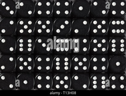Background pattern of black dices, random ordered Stock Photo