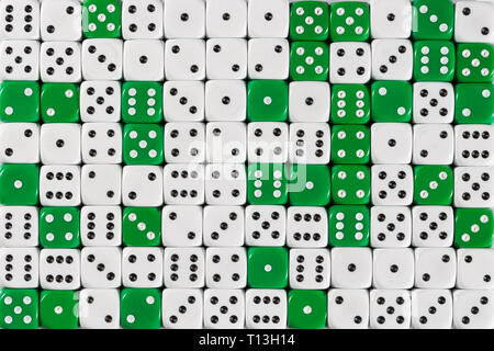 Background patteren of random ordered white and green dices Stock Photo