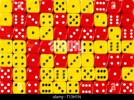 Background of 70 random ordered red and yellow dices Stock Photo