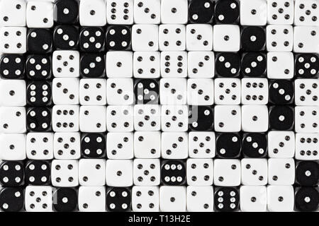 Background patteren of random ordered white and black dices Stock Photo