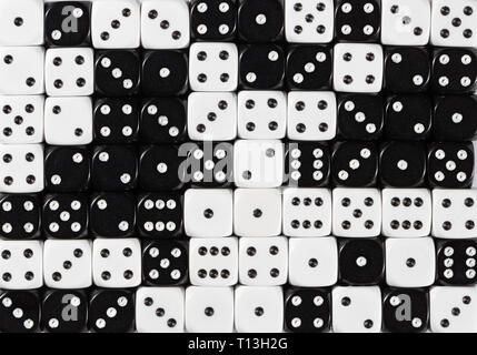 Background of 70 random ordered black and white dices Stock Photo