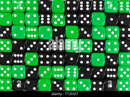 Background of 70 random ordered black and green dices Stock Photo