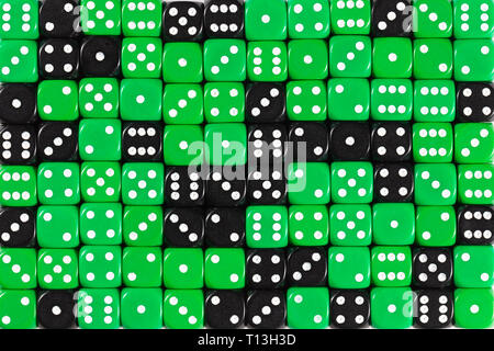 Background patteren of random ordered green and black dices Stock Photo