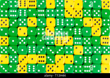 Background patteren of random ordered green and yellow dices Stock Photo