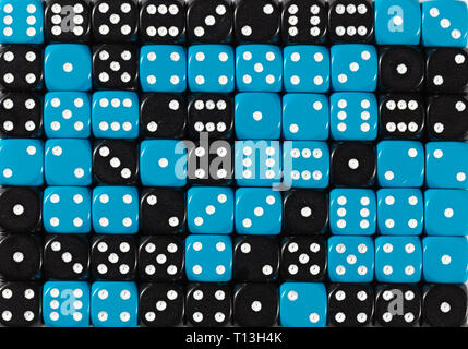 Background of 70 random ordered black and blue dices Stock Photo