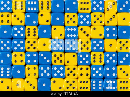 Background of 70 random ordered blue and yellow dices Stock Photo