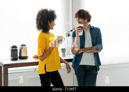 Colleagues having a coffee break in the office Stock Photo