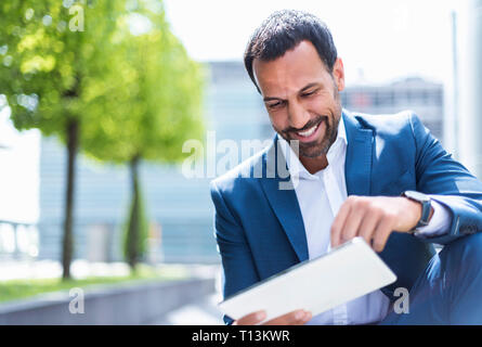 Business man using tablet Stock Photo