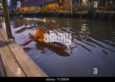 Amphawa, Thailand. October 25, 2015. Monk collecting morning Alms in Amphawa. Stock Photo