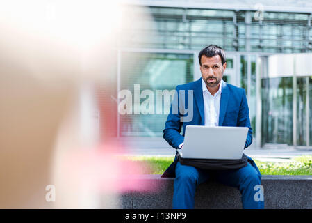 Businessman using laptop Stock Photo