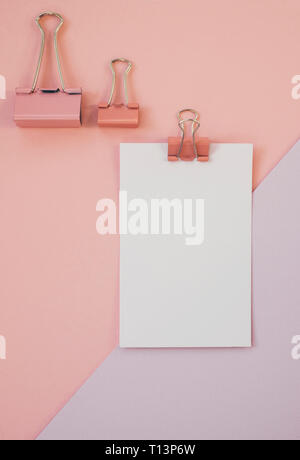 Blank paper against pink and purple background Stock Photo