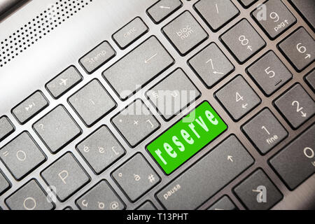 green button on the computer with the word Reserve Stock Photo