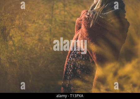 Close-up of pregnant woman standing in nature in autumn Stock Photo