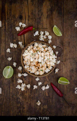 Bowl of popcorn flavoured with chili and lime Stock Photo