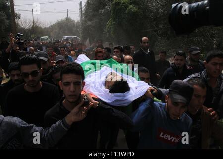 March 23, 2019 - Al-Mograga, The Gaza Strip, Palestine - Palestinians mourners Nidal Shatat 29 years old from al-Mograga in the middle of the Gaza strip during his funeral, Nidal killed by Israeli troops during his participation in the Great March of Return eastern of the Gaza strip yesterday. Credit: Mahmoud Khattab/Quds Net News/ZUMA Wire/Alamy Live News Stock Photo