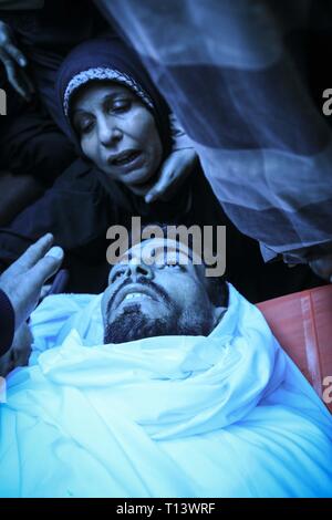 March 23, 2019 - Al-Mograga, The Gaza Strip, Palestine - Palestinians mourners Nidal Shatat 29 years old from al-Mograga in the middle of the Gaza strip during his funeral, Nidal killed by Israeli troops during his participation in the Great March of Return eastern of the Gaza strip yesterday. Credit: Mahmoud Khattab/Quds Net News/ZUMA Wire/Alamy Live News Stock Photo