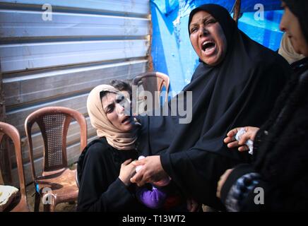 March 23, 2019 - Al-Mograga, The Gaza Strip, Palestine - Palestinians mourners Nidal Shatat 29 years old from al-Mograga in the middle of the Gaza strip during his funeral, Nidal killed by Israeli troops during his participation in the Great March of Return eastern of the Gaza strip yesterday. Credit: Mahmoud Khattab/Quds Net News/ZUMA Wire/Alamy Live News Stock Photo