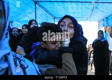 March 23, 2019 - Al-Mograga, The Gaza Strip, Palestine - Palestinians mourners Nidal Shatat 29 years old from al-Mograga in the middle of the Gaza strip during his funeral, Nidal killed by Israeli troops during his participation in the Great March of Return eastern of the Gaza strip yesterday. Credit: Mahmoud Khattab/Quds Net News/ZUMA Wire/Alamy Live News Stock Photo