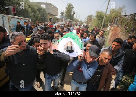 March 23, 2019 - Al-Mograga, The Gaza Strip, Palestine - Palestinians mourners Nidal Shatat 29 years old from al-Mograga in the middle of the Gaza strip during his funeral, Nidal killed by Israeli troops during his participation in the Great March of Return eastern of the Gaza strip yesterday. Credit: Hassan Jedi/Quds Net News/ZUMA Wire/Alamy Live News Stock Photo