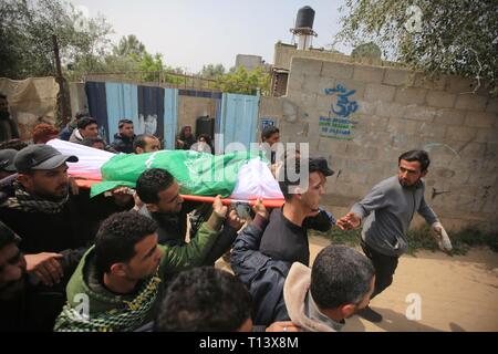 March 23, 2019 - Al-Mograga, The Gaza Strip, Palestine - Palestinians mourners Nidal Shatat 29 years old from al-Mograga in the middle of the Gaza strip during his funeral, Nidal killed by Israeli troops during his participation in the Great March of Return eastern of the Gaza strip yesterday. Credit: Hassan Jedi/Quds Net News/ZUMA Wire/Alamy Live News Stock Photo