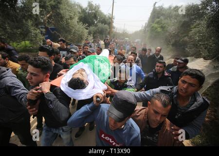 March 23, 2019 - Al-Mograga, The Gaza Strip, Palestine - Palestinians mourners Nidal Shatat 29 years old from al-Mograga in the middle of the Gaza strip during his funeral, Nidal killed by Israeli troops during his participation in the Great March of Return eastern of the Gaza strip yesterday. Credit: Hassan Jedi/Quds Net News/ZUMA Wire/Alamy Live News Stock Photo