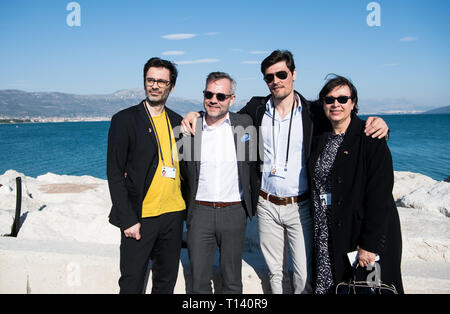 Split, Croatia. 22nd Mar, 2019. Nicol Ljubic (l-r), journalist, Michael Roth (SPD), Minister of State for Europe in the Federal Foreign Office, Stipe Erceg, actor, and Alida Bremer, writer, have themselves photographed in the port of Divulje. President Steinmeier and his wife are on a two-day visit to Croatia. Credit: Bernd von Jutrczenka/dpa/Alamy Live News Stock Photo