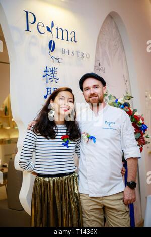 (190323) -- GUANGZHOU, March 23, 2019 (Xinhua) -- Undated file photo shows French baker Christophe (R) and his wife Agnes at their bakery store in Guangzhou, south China's Guangdong Province. French baker Christophe and his wife Agnes started their first French bakery store called 'Perma' in 2012 and the second one last year in Guangzhou. Catering to locals in Guangzhou, Christophe made bread with the integration of French bakery flavors and local cuisine culture. As France becomes an increasingly popular tourist destination for young Chinese people, the couple would be more dedicated to makin Stock Photo