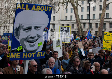 London, UK. 23rd March, 2019.  The Put it to the People March in London: people with home-made placards march past the gates of Downing Street on Whitehall. Credit: Anna Watson/Alamy Live News Stock Photo