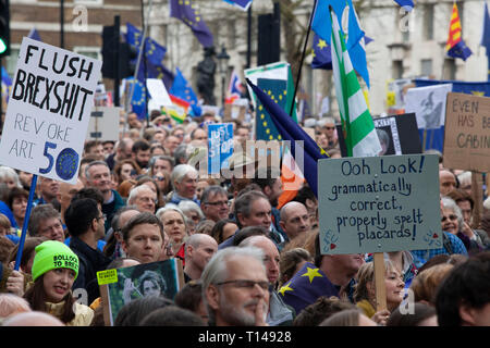 London, UK. 23rd March, 2019. The Put it to the People March in London: people with home-made placards march past the gates of Downing Street on Whitehall. Credit: Anna Watson/Alamy Live News Stock Photo