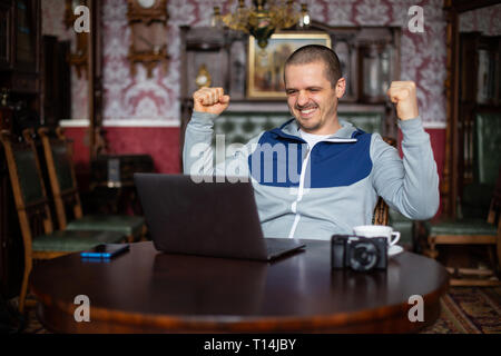 Man getting success. Freelancer happy with result. Stock Photo