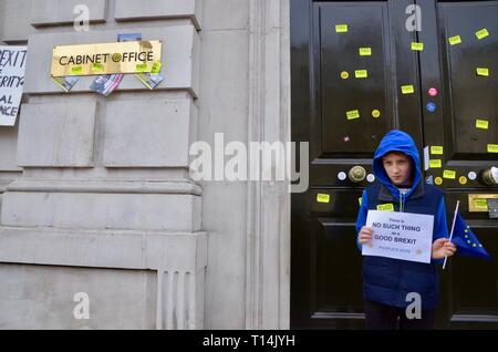 scenes from the anti brexit pro peoples vote march in london 23rd march 2019 boy outside stickered cabinet office whitehall