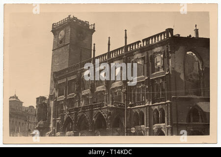 Damages on the tower of the Old Town Hall (Staroměstská radnice) in Old Town Square (Staroměstské náměstí) in Prague, Czechoslovakia, damaged during the Prague Uprising in the last days of World War II in May 1945. Black and white vintage photograph by an unknown photographer taken in May 1945. Courtesy of the Azoor Photo Collection. Stock Photo